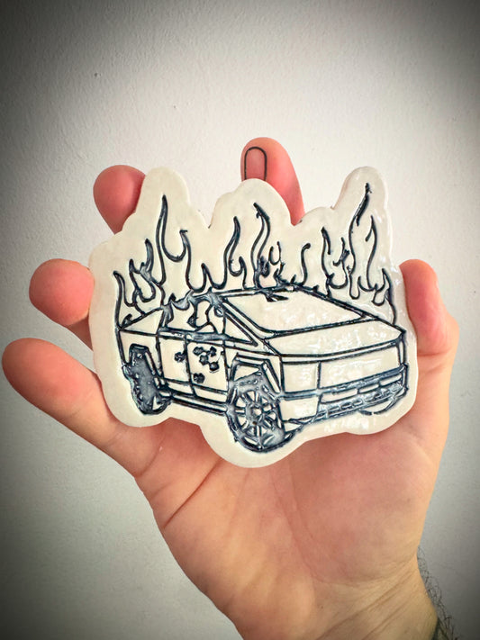 Burning cybertruck ornament